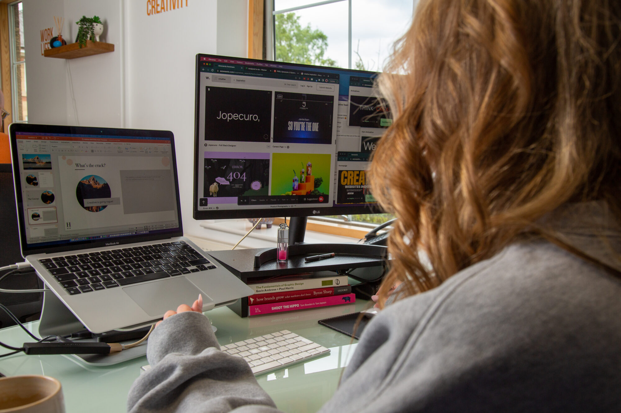 over the shoulder shot of team member working on a branding project