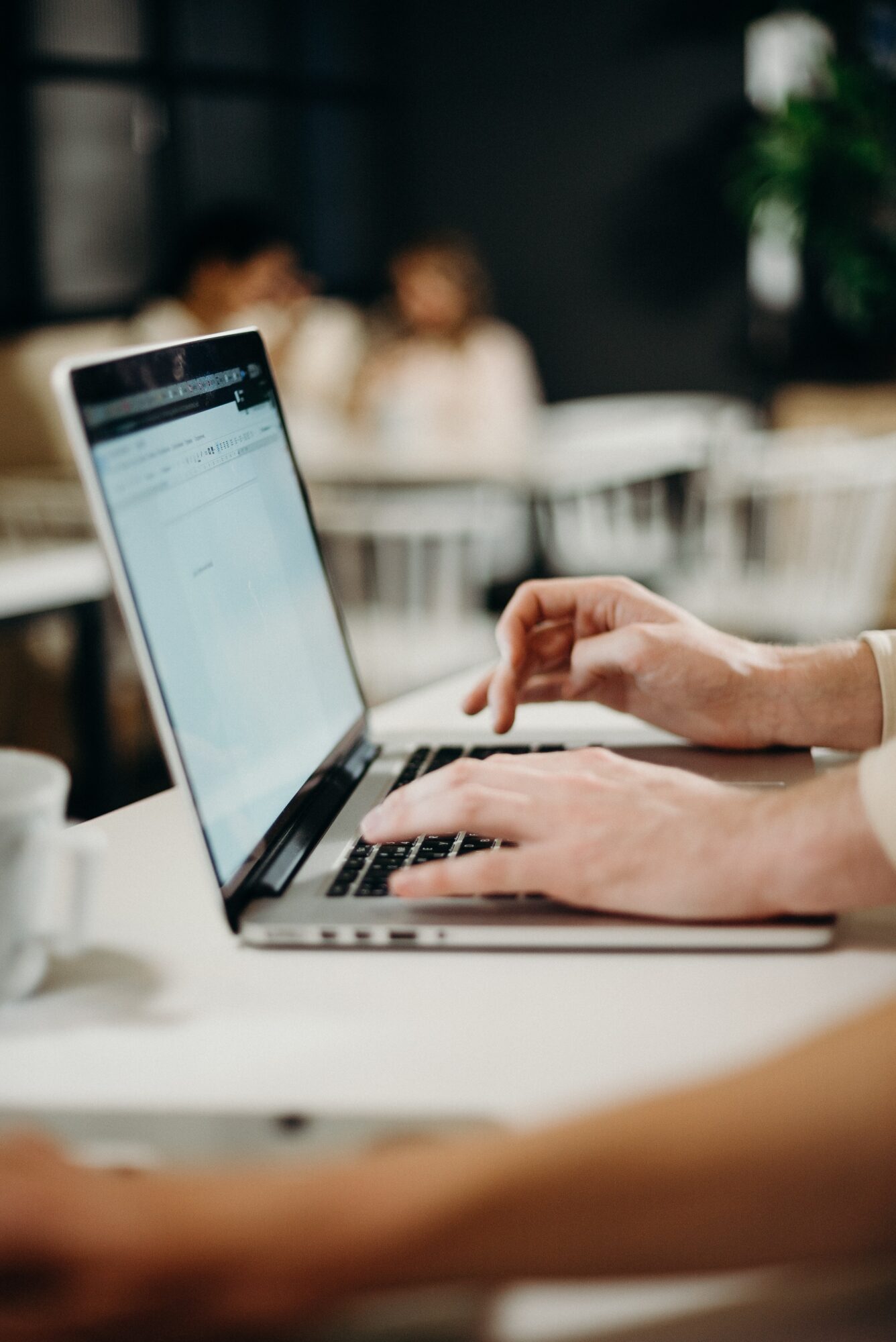 Person typing on a laptop