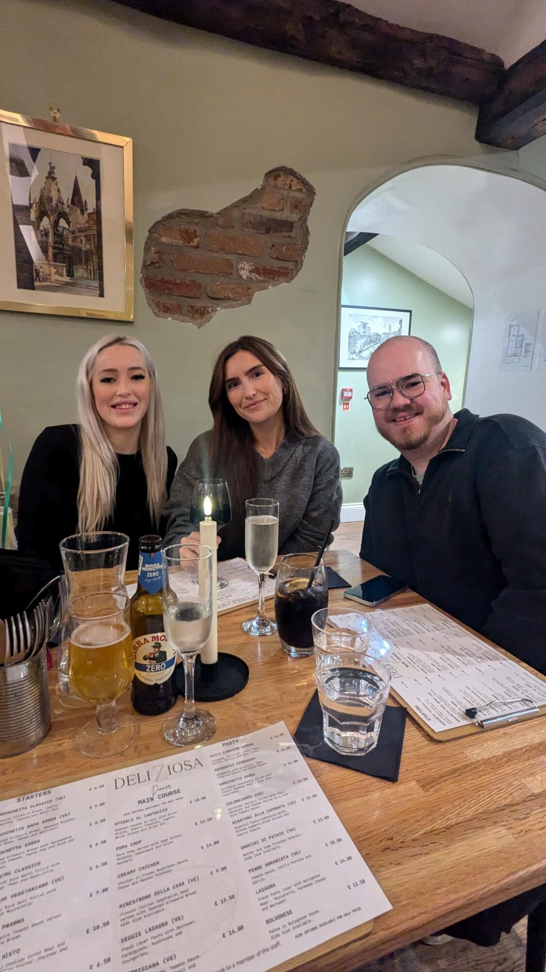 Three members of the Halston B2B team sitting in a restaurant