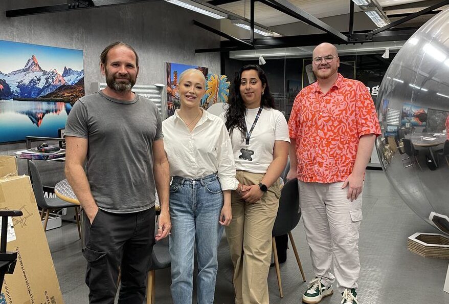 3 members of the Halston B2B team with a member of the Imageco team on a tour of Imageco's factory