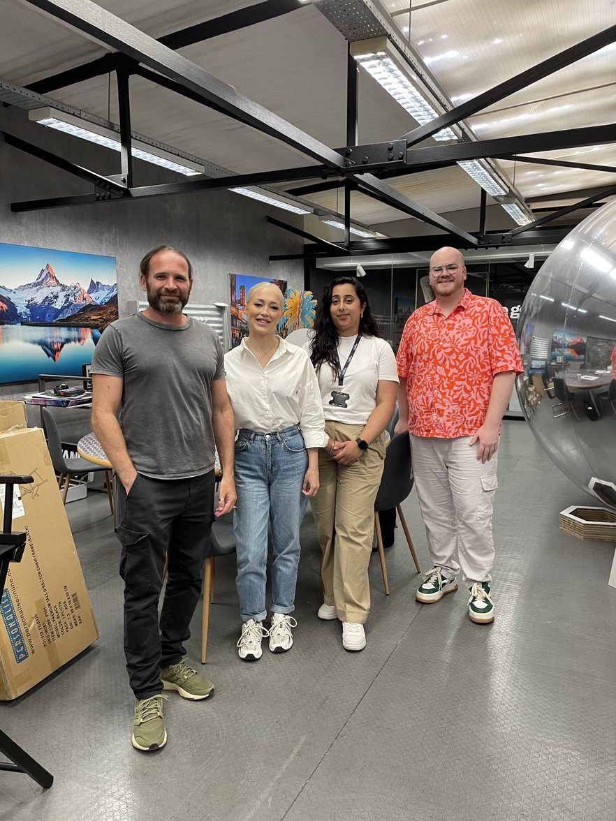 3 members of the Halston B2B team with a member of the Imageco team on a tour of Imageco's factory
