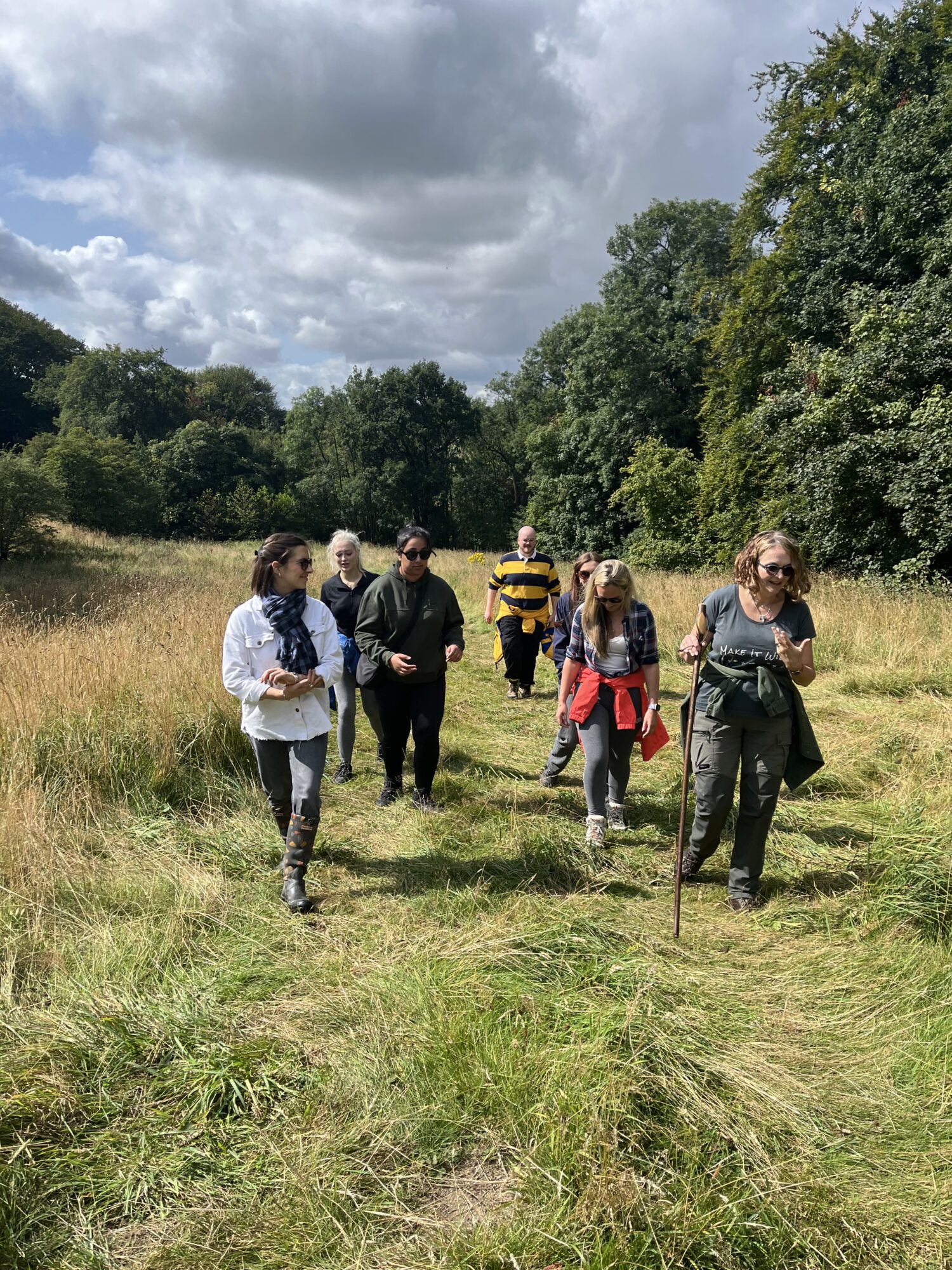 6 members of the Halston B2B team getting a tour of Bank Wood from a Make It Wild team member