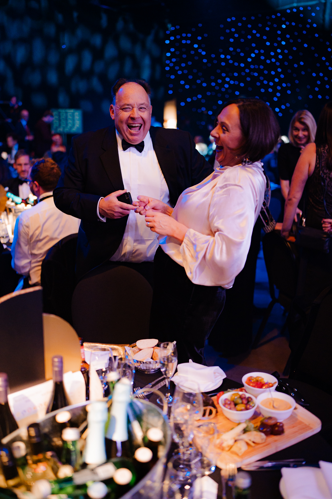 Man and woman dancing at nexus anniversary dinner